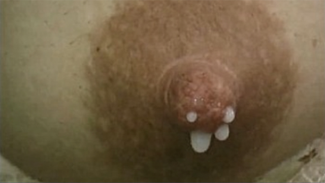 Lactating woman relieves swollen breasts video from Analovetto