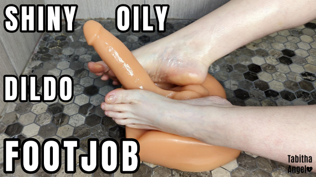 Shiny Oily Dildo Footjob video from Tabitha Angel