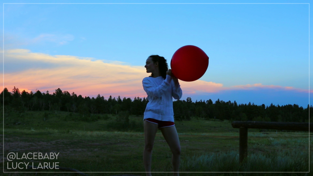 White Sweater Sunset and a Big Red Balloon