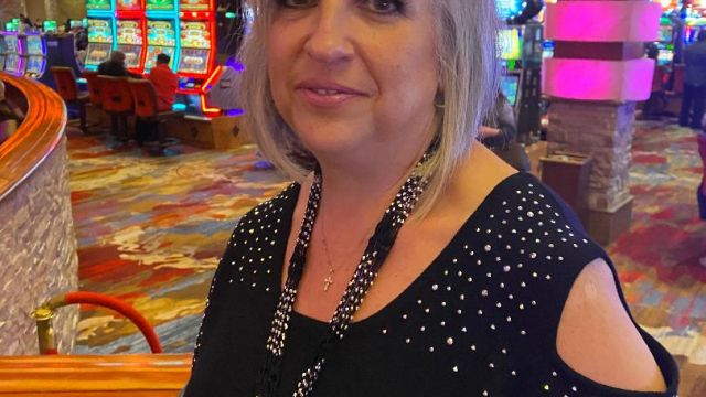 Rose putting on the gloves at the casino. video from Mistress Rose